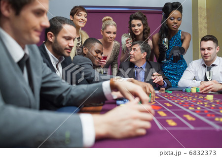Women watching men play roulette Women watching men play roulette 6832373