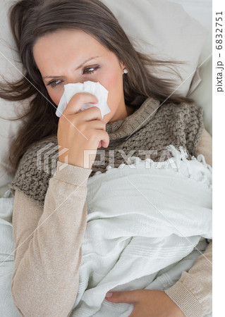Sick woman on the couch 6832751