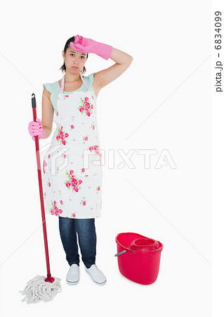 Discouraged woman cleaning floor Discouraged woman cleaning floor 6834099