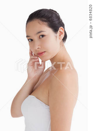 Woman holding her chin Woman holding her chin 6834820