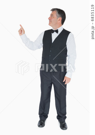 Man pointing something above him Man pointing something above him 6835119