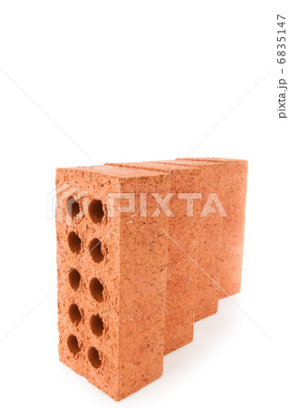 Four clay bricks positioned in a row Four clay bricks positioned in a row 6835147