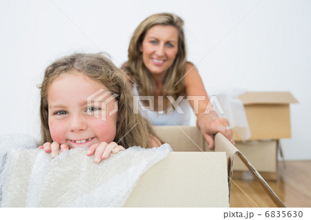 Girl sitting in box 6835630