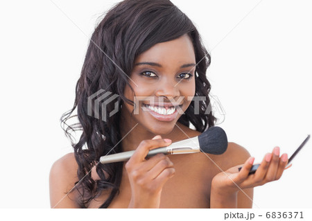 Woman holding powder and a brush 6836371