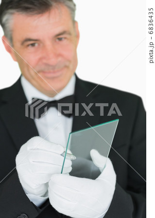 Smiling waiter using virtual screen Smiling waiter using virtual screen 6836435