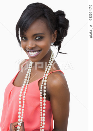 Woman wearing pink dress and pearls Woman wearing pink dress and pearls 6836479