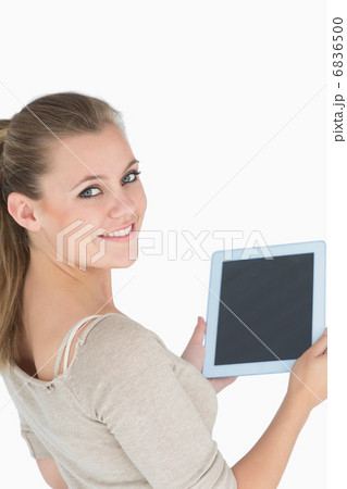 Woman showing a screen tablet Woman showing a screen tablet 6836500