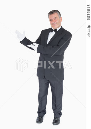 Man showing us something against white background 6836618