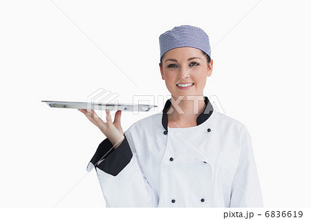 Chef holding an empty silver tray Chef holding an empty silver tray 6836619