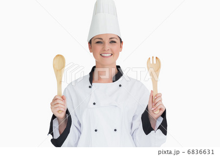 Cook holding wooden salad tosses 6836631