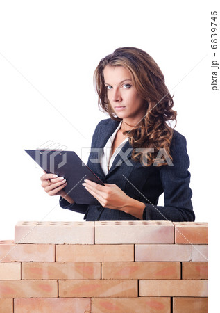 Woman builder and brick wall Woman builder and brick wall 6839746