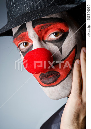 Businessman with clown wig and face paint Businessman with clown wig and face paint 6839890