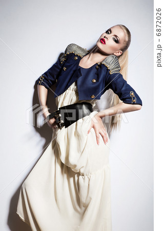 sexy blonde woman in long white dress and jacket 6872026