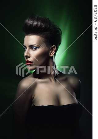 sexy woman with red lips in green light 6872028