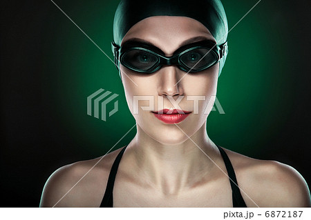 swimmer in glasses on dark green background 6872187