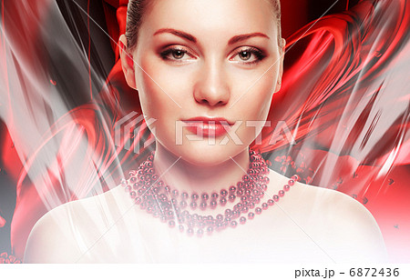 beautiful woman with accessorize on neck on red fabric backgroun 6872436