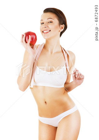woman with white tapemeasure and red apple 6872493