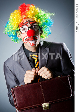 Businessman with clown wig and face paint 6878013