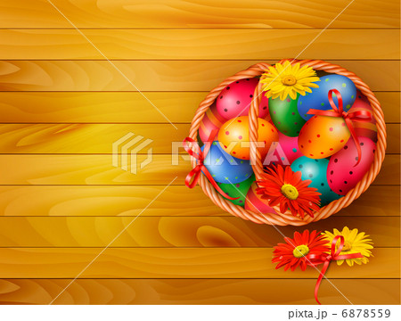 Easter background with color easter eggs in basket on wooden tab 6878559