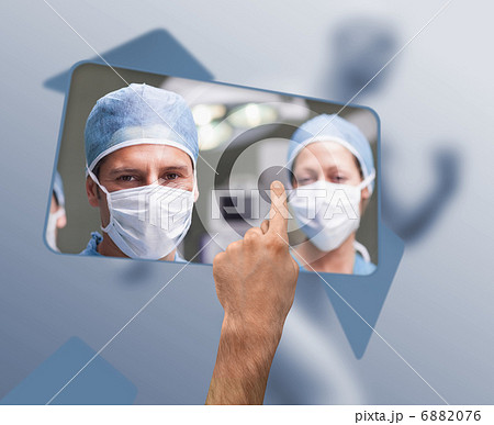 Hand selecting image of surgeons Hand selecting image of surgeons 6882076