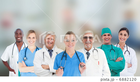 Smiling medical team standing in line Smiling medical team standing in line 6882120