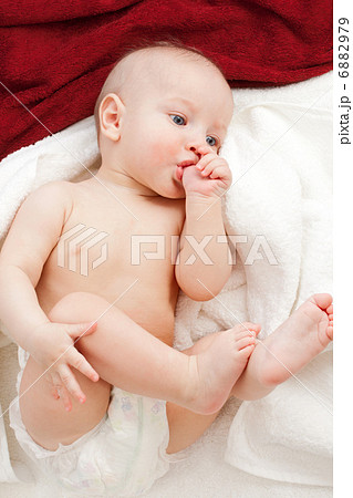 Baby in white and red towels 6882979