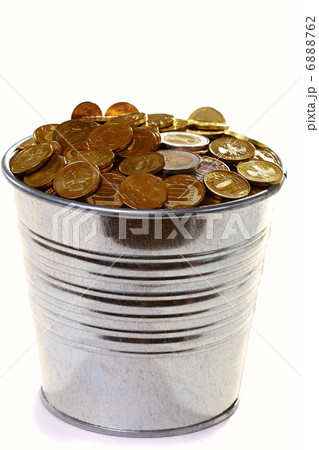 Zinc bucket of gold coins on a white background. Zinc bucket of gold coins on a white background. 6888762