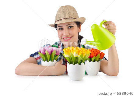 Girl watering plants on white 6889046