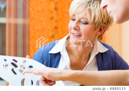 Deaf woman with hearing aid Deaf woman with hearing aid 6889133