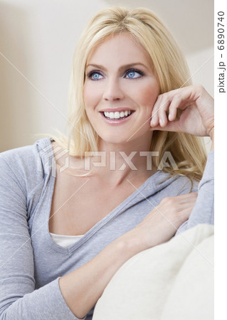 Portrait of Beautiful Young Blond Woman With Blue Eyes Portrait of Beautiful Young Blond Woman With Blue Eyes 6890740