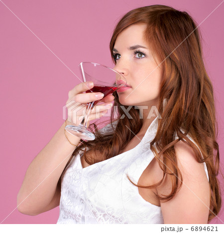 Cute female drinks cocktail 6894621