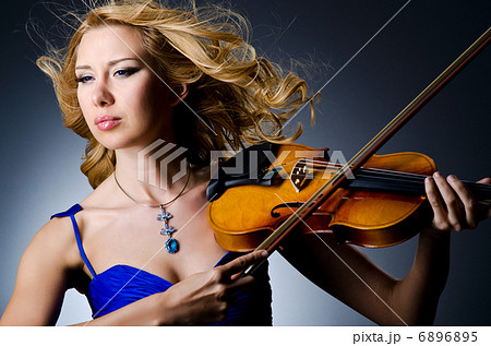 Woman with violin in studio Woman with violin in studio 6896895