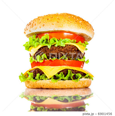 Tasty and appetizing hamburger on a white Tasty and appetizing hamburger on a white 6901456