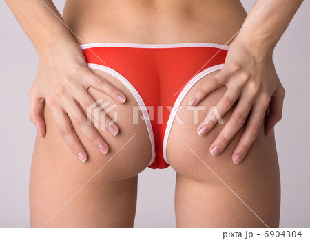 beauty girl back in red string over gray background 6904304