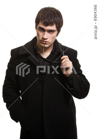 confidence man in black coat and sunglasses 6904366