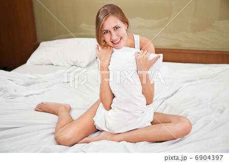 Portrait of Fresh and Beautiful woman on bed 6904397