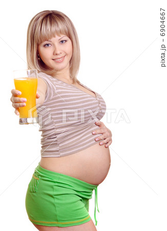 Portrait of pregnant woman with orange juice in hand isolated on Portrait of pregnant woman with orange juice in hand isolated on 6904667