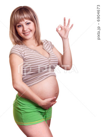 happy pregnant woman show ok sign 6904673