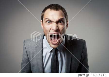 Angry businessman shouting 6904712