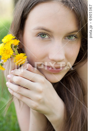 young beautiful teenager with dandelion bouquet 6905367