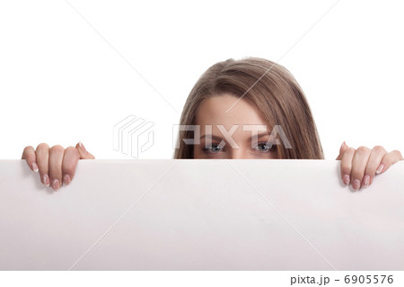 Woman looking over blank card in the studio 6905576