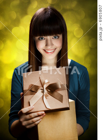 Happy Teen Girl with Gift 6905807