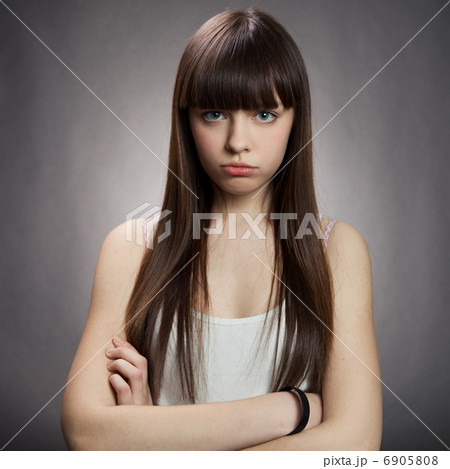 Portrait of a charming young female against dark background 6905808