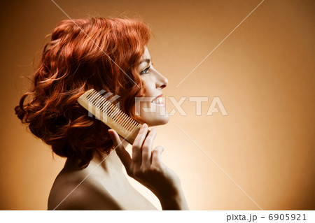 Beauty Portrait. Curly Hair and Comb 6905921