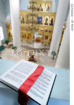 Orthodox Holy Bible on the table agains the sanctuary Orthodox Holy Bible on the table agains the sanctuary 6906295