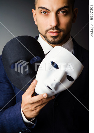 Man with black mask in studio 6907308