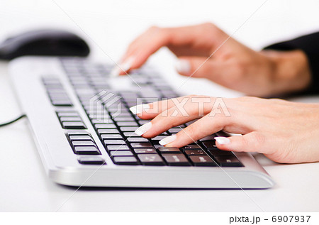 Hands working on the keyboard Hands working on the keyboard 6907937