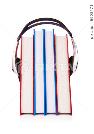 Concept of audio books with earphones on white Concept of audio books with earphones on white 6908471