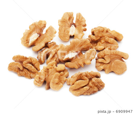Heap of fresh shelled walnuts on white background. Close-up. 6909947