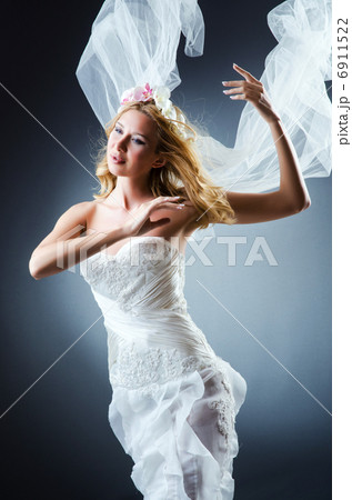 Bride in white dress in studio 6911522